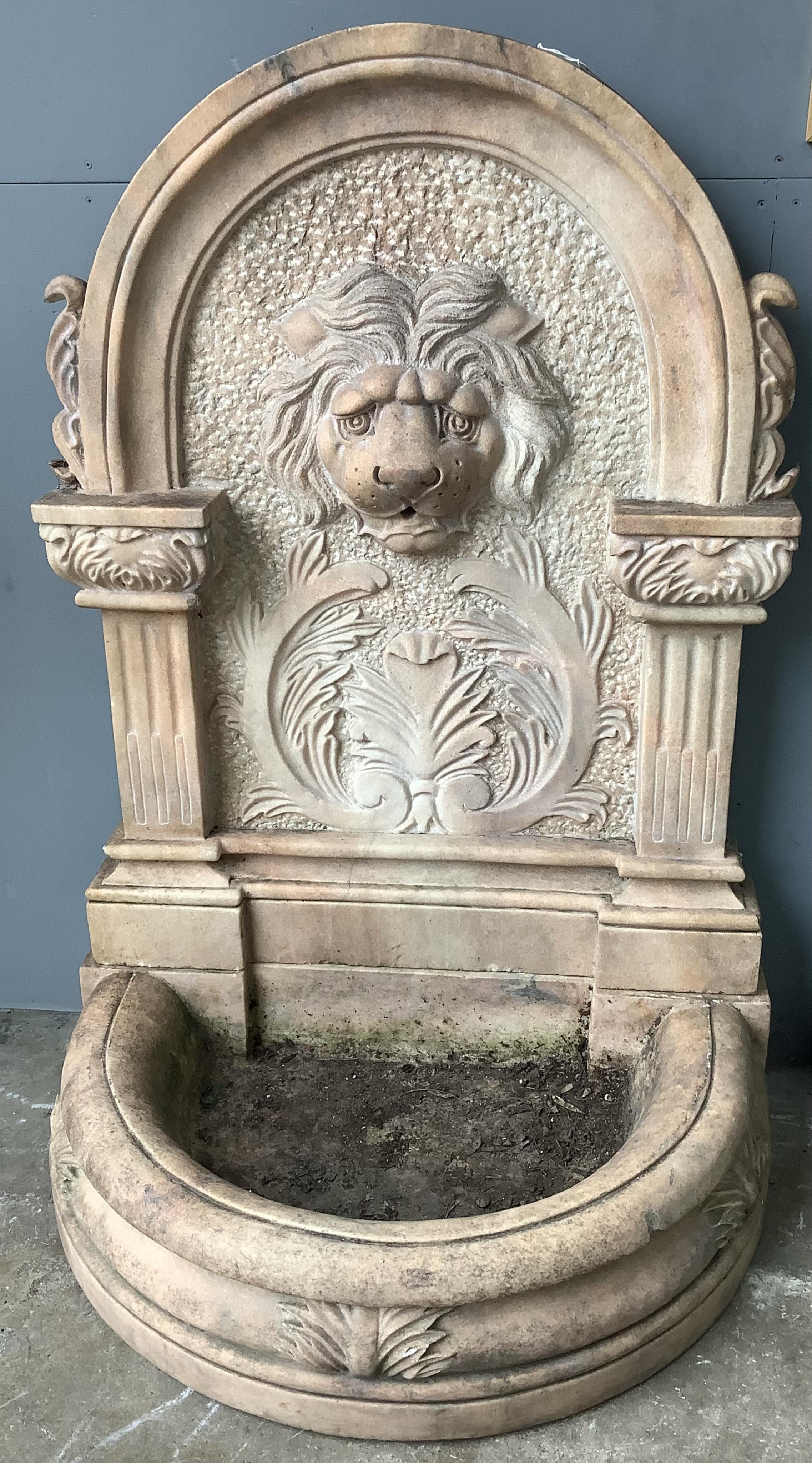 An Italian rose marble garden fountain with lion mask spout, width 94cm, height 135cm